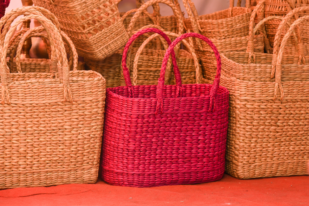 Wicker baskets arranged for display at Mon Ami City Hotel, located near the Artisan Showcase, highlighting artisanal work.