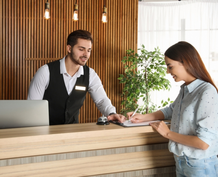 A welcoming lobby of Mon Ami City Hotel showcasing exceptional customer service and elegant decor for guests.