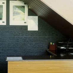 An office area with a desk and computer, designed to provide a modern and inviting work environment.