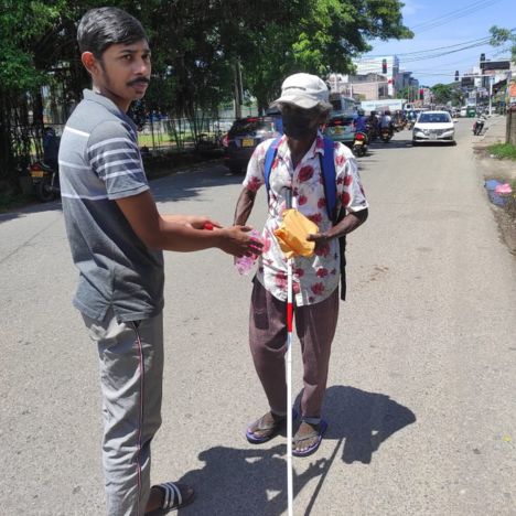 Mon Ami City Hotel donates food to a blind individual, showcasing community support and compassion for those in need.