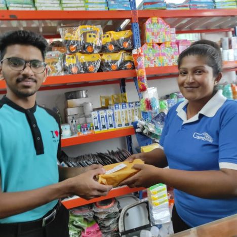 Mon Ami City Hotel staff donating food at a supermarket, showcasing community support and generosity in action.