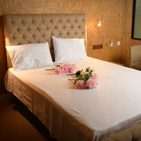 A well-appointed double bed room in Mon Ami City Hotel, highlighting modern design and inviting ambiance for guests.